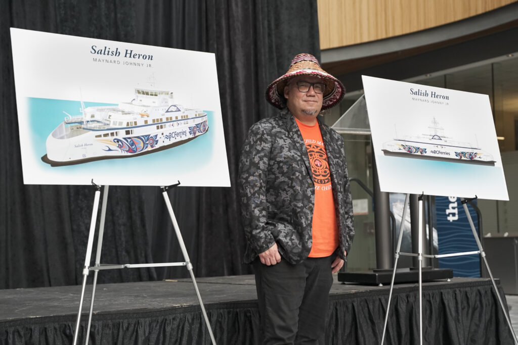 Coast Salish artist Maynard Johnny Jr. with his winning design for the Salish Heron artwork