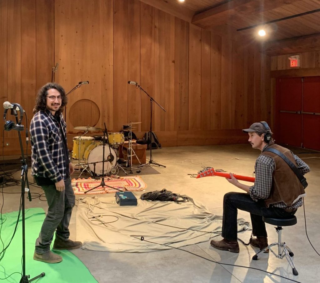 Jeremy Pahl in the recording studio with guitarist 